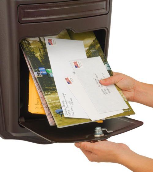 Open brown wall mount mailbox with mail inside