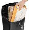 Open black wall mount mailbox with mail inside