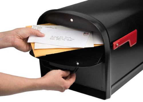 Open mailbox with mail inside and red flag