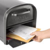 Open black mailbox with mail inside