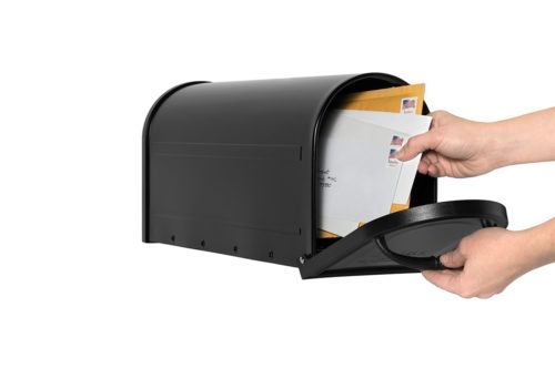 Open black mailbox with mail being delivered inside