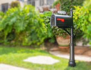 Decorative black mailbox on lawn