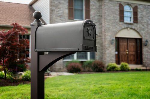 Side of Bronze Post Mount Mailbox with Decorative Background