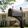 Side of Bronze Post Mount Mailbox with Red Flag Raised