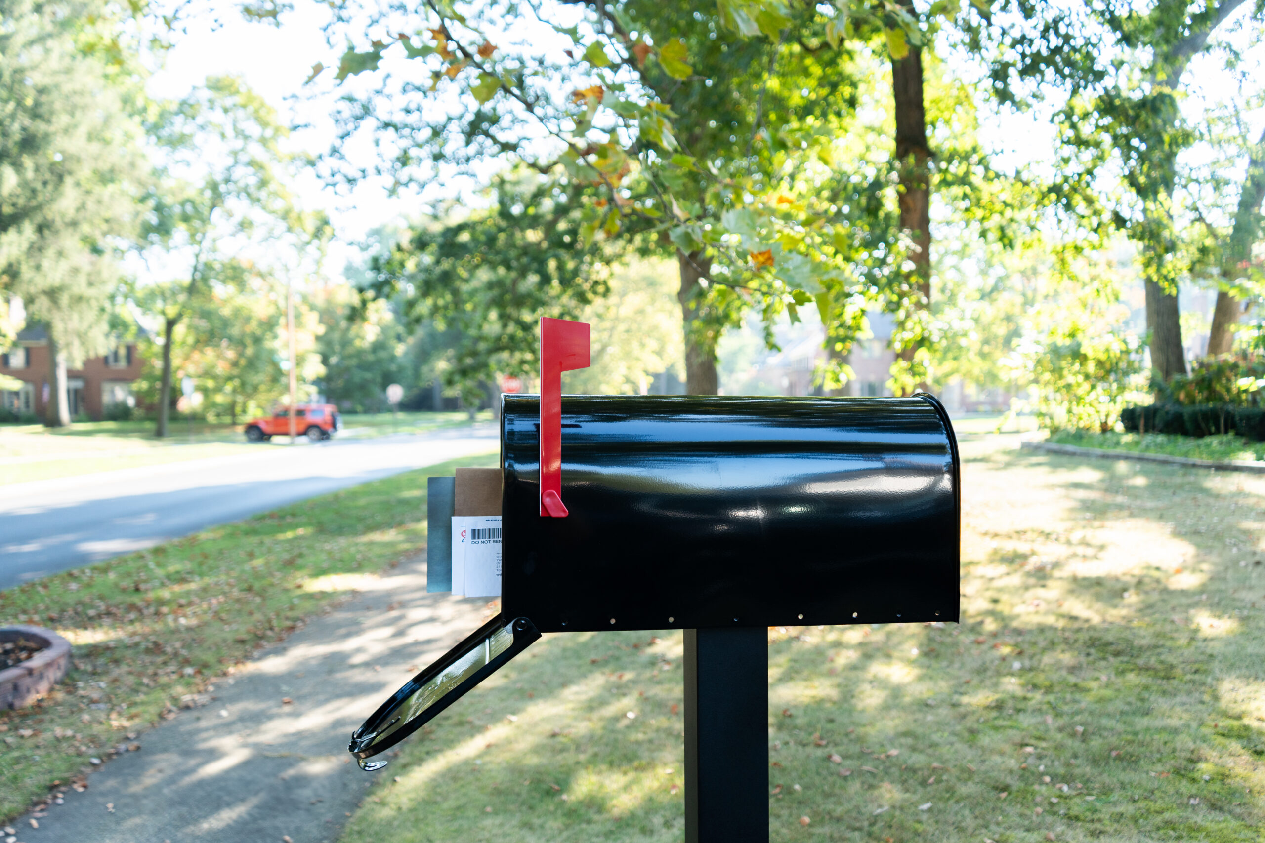 Black Architectural Mailboxes post-mount mailbox installed curbside