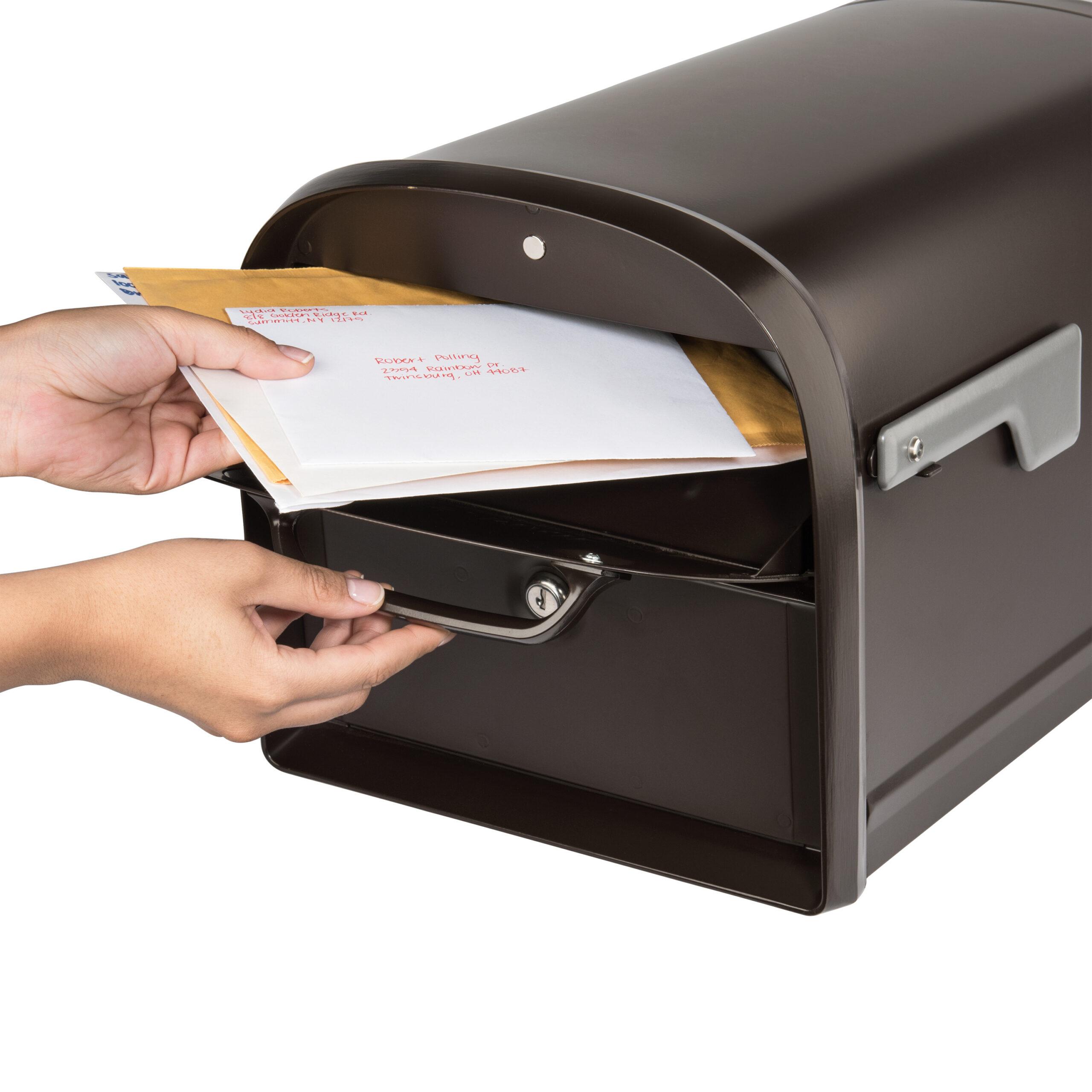 Person inserts envelopes into a dark brown curved mailbox with a handle and lock.