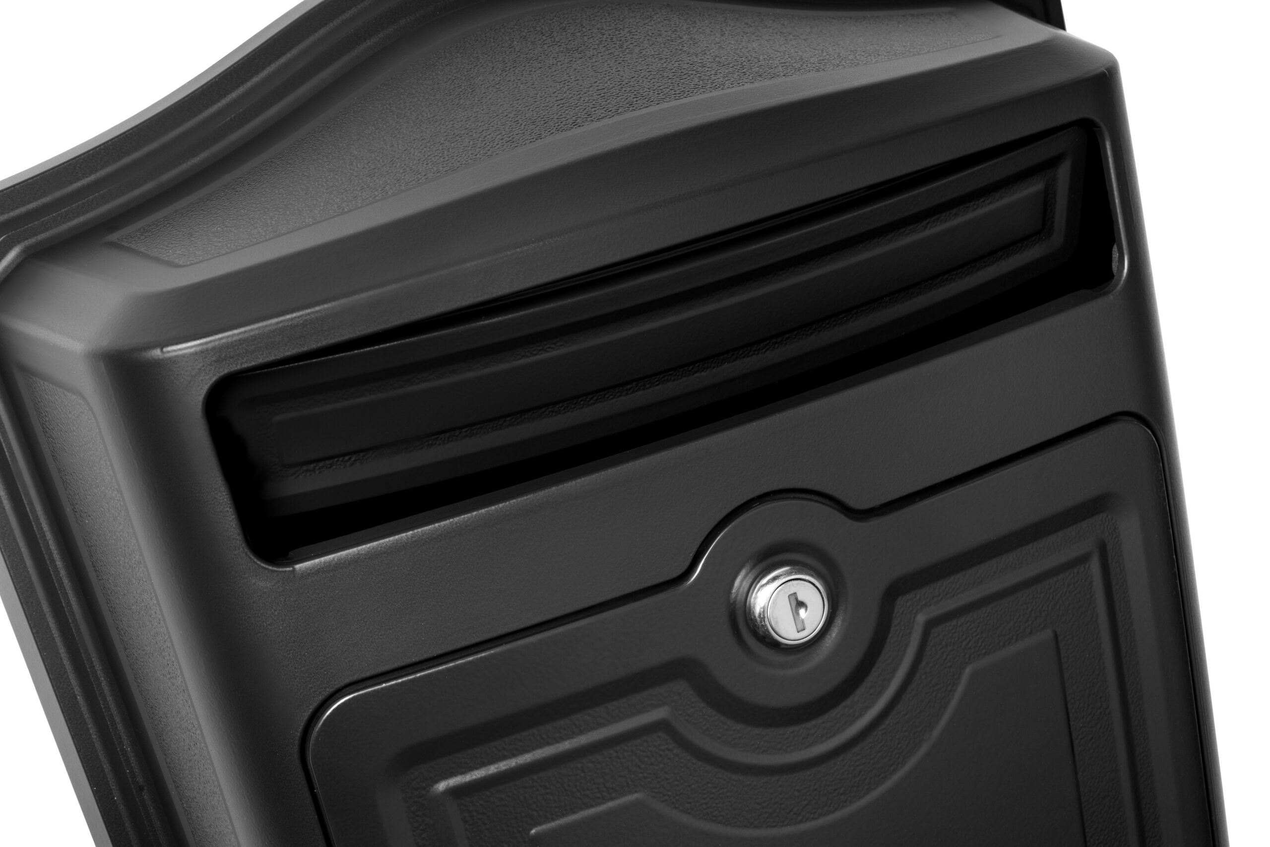 Close-up of a black metal safe showing a horizontal deposit slot and a circular keyhole on the front panel.