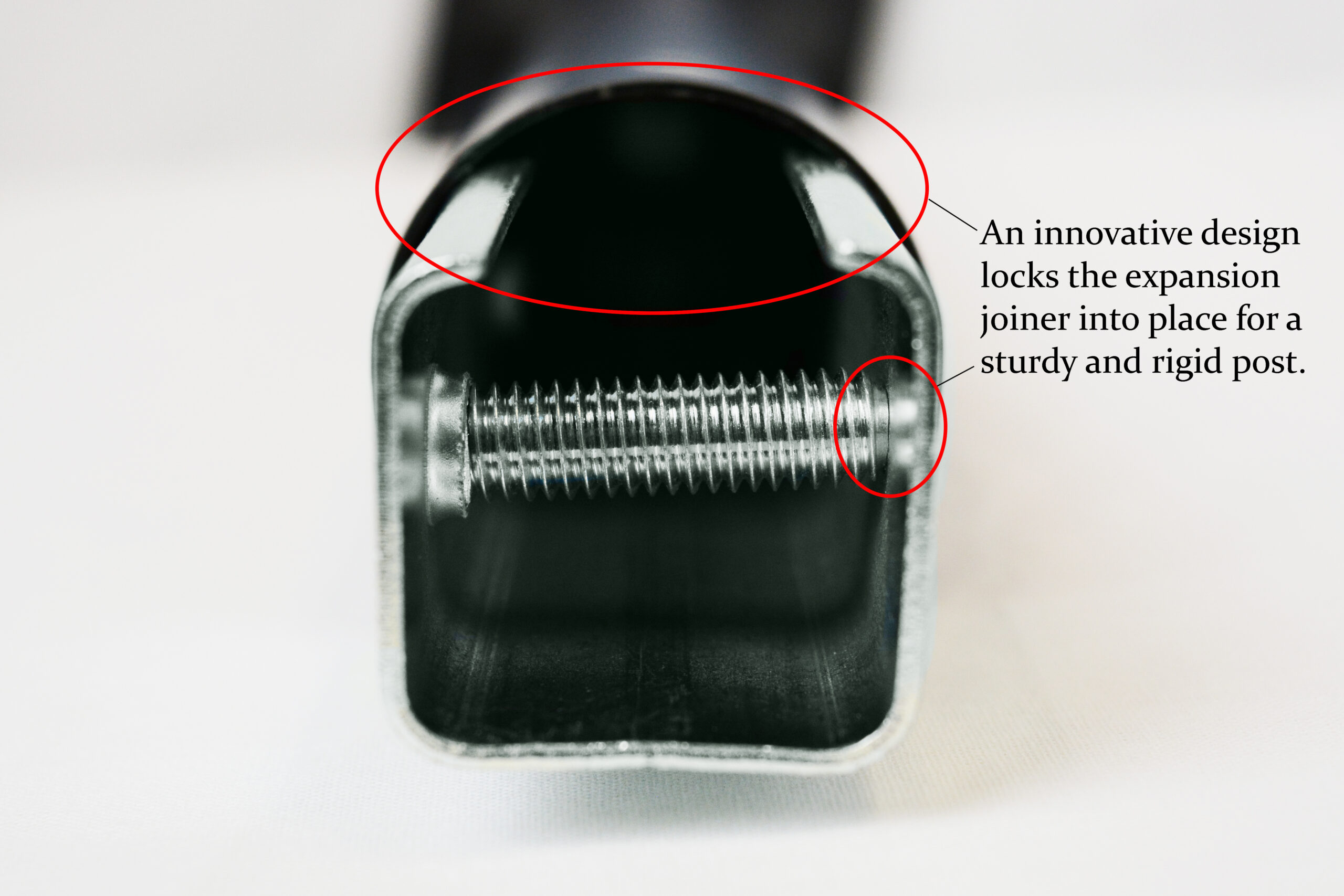 Close-up of a metal bolt showing a locking mechanism that secures an expansion joiner into a sturdy post.