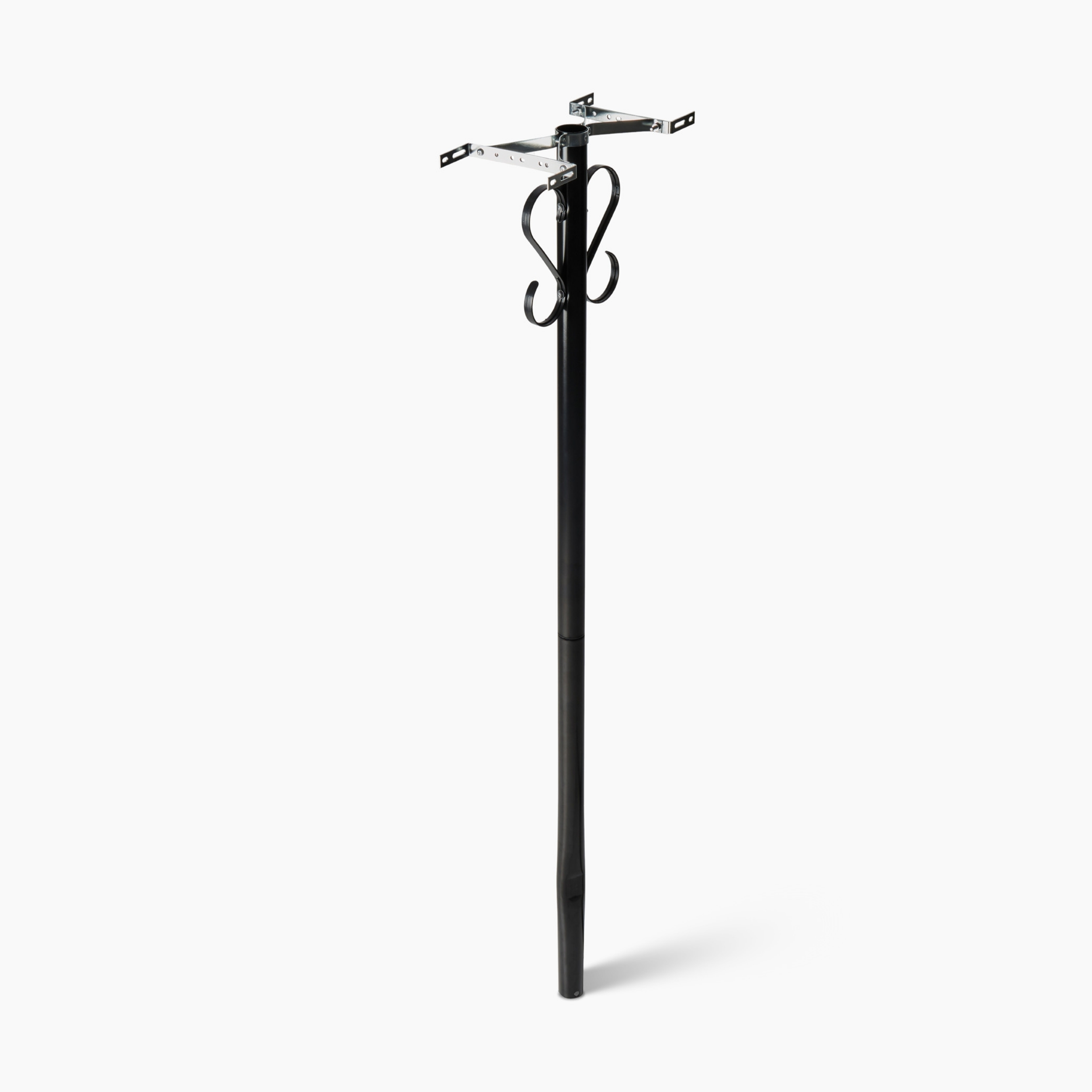 Tall black freestanding coat rack with four curled metal hooks at the top, standing on a simple base.