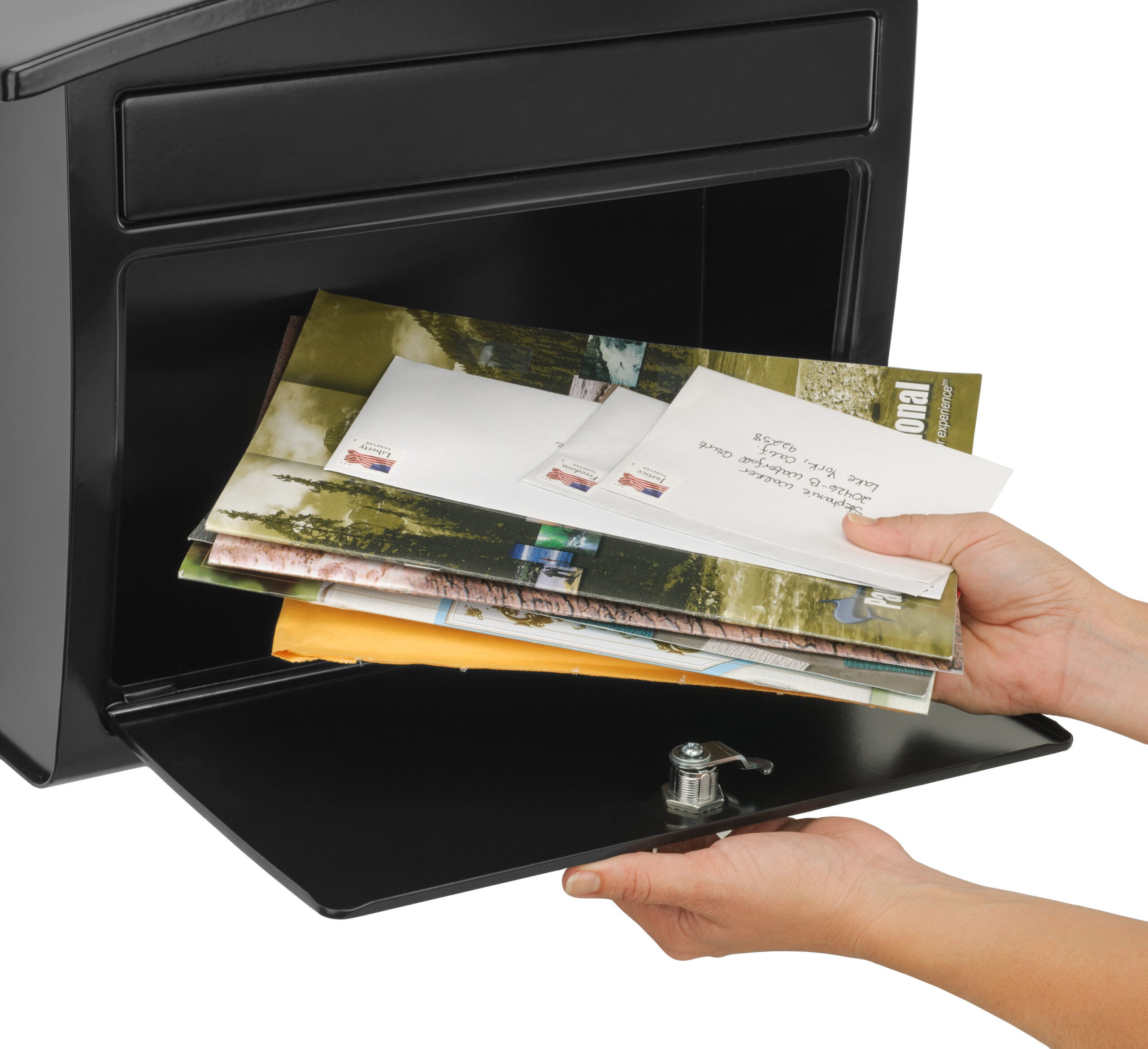 Person placing a stack of envelopes into a black mailbox slot, hands visible from below.