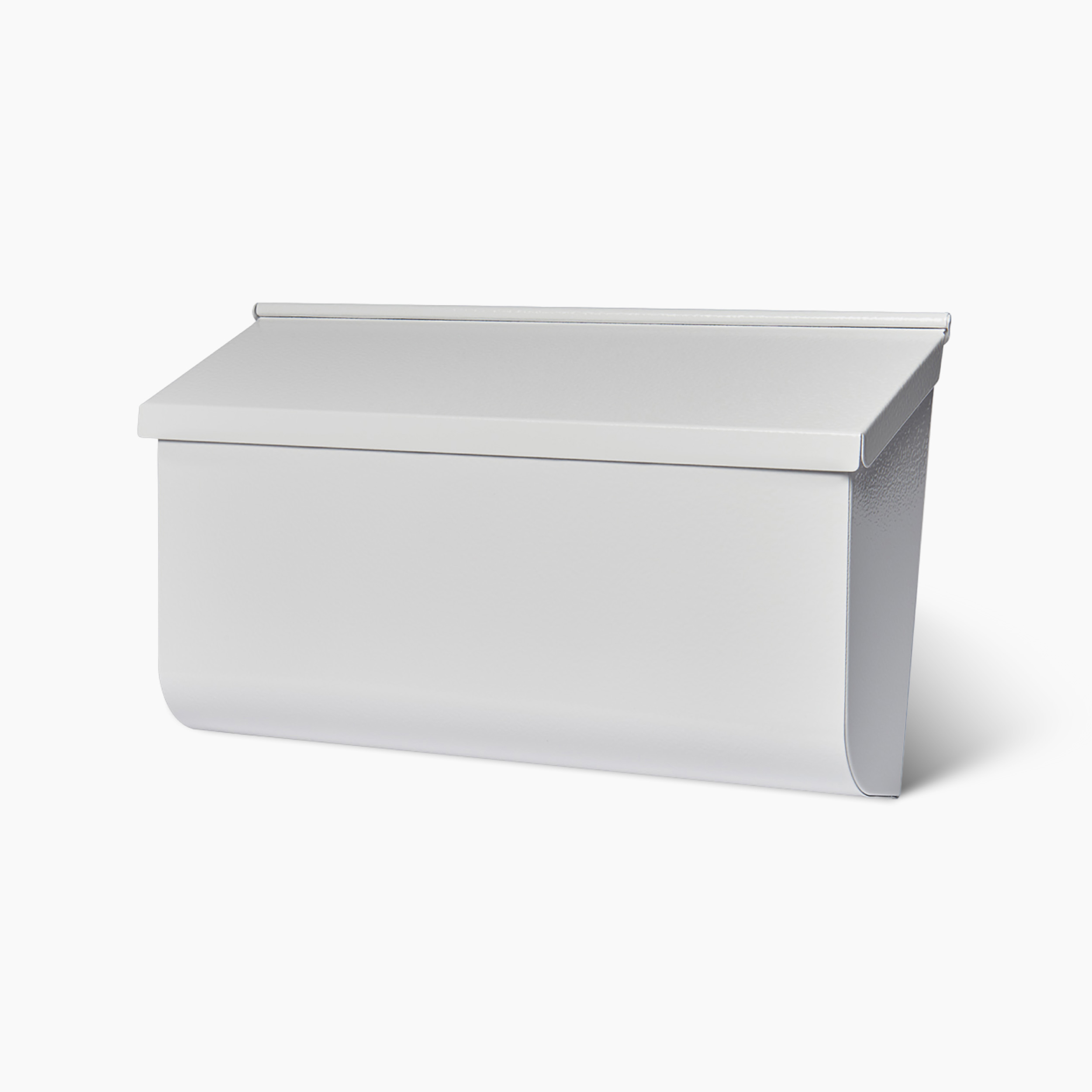 White metal mailbox with a hinged lid and curved bottom edge on a plain background.