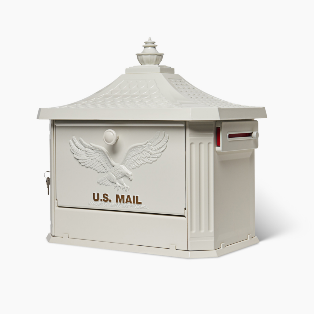 White U.S. Mail mailbox with an embossed eagle on the front and a slot for mail.