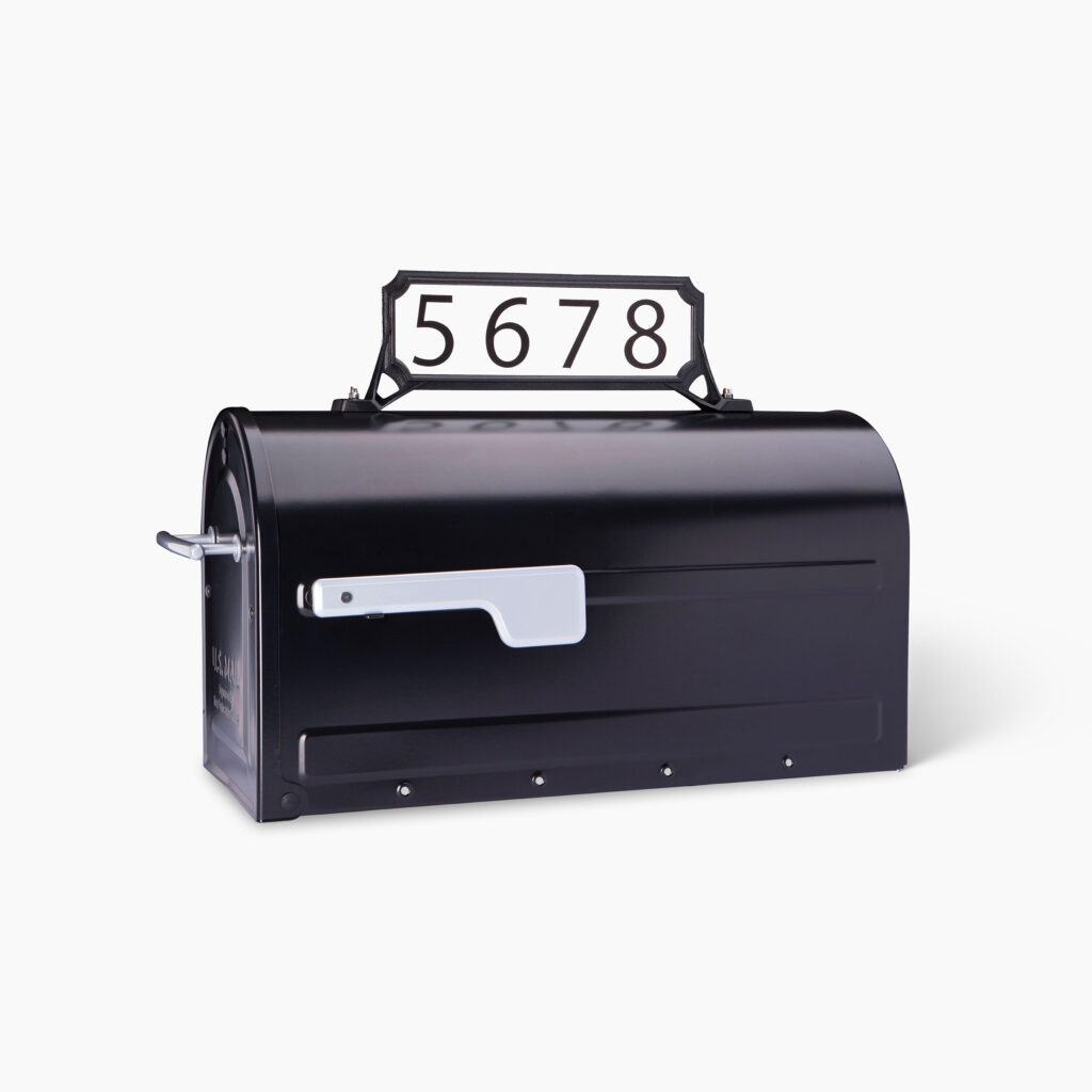 Black metal curbside mailbox with a white address plaque reading 5678 on top and a silver lever on the side.