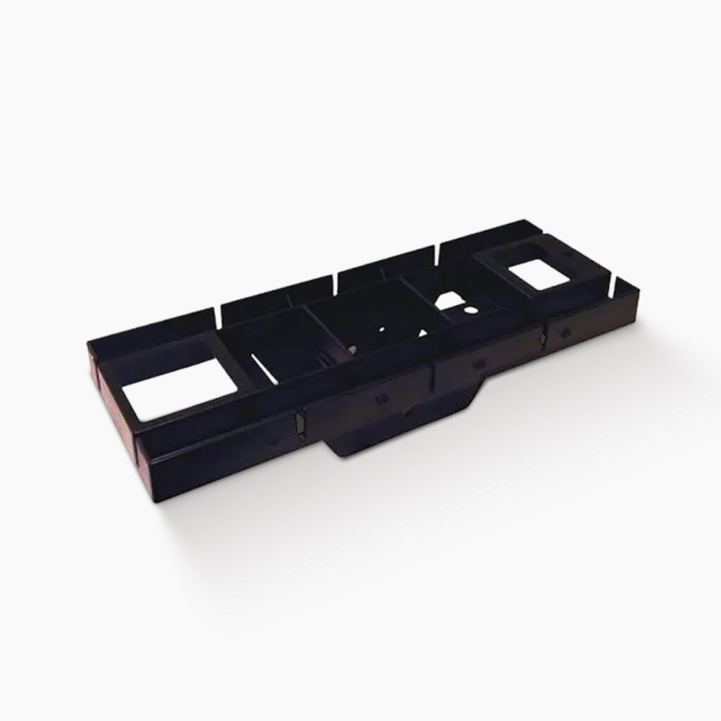 Long black plastic tray with multiple rectangular compartments, likely a vehicle interior console part.