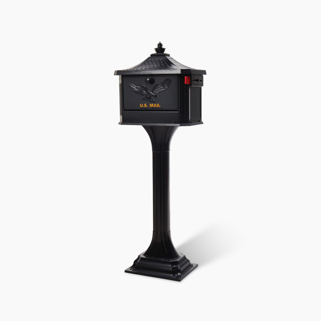 Black U.S. Mail mailbox mounted on a tall pedestal stand with an eagle emblem on the front panel.