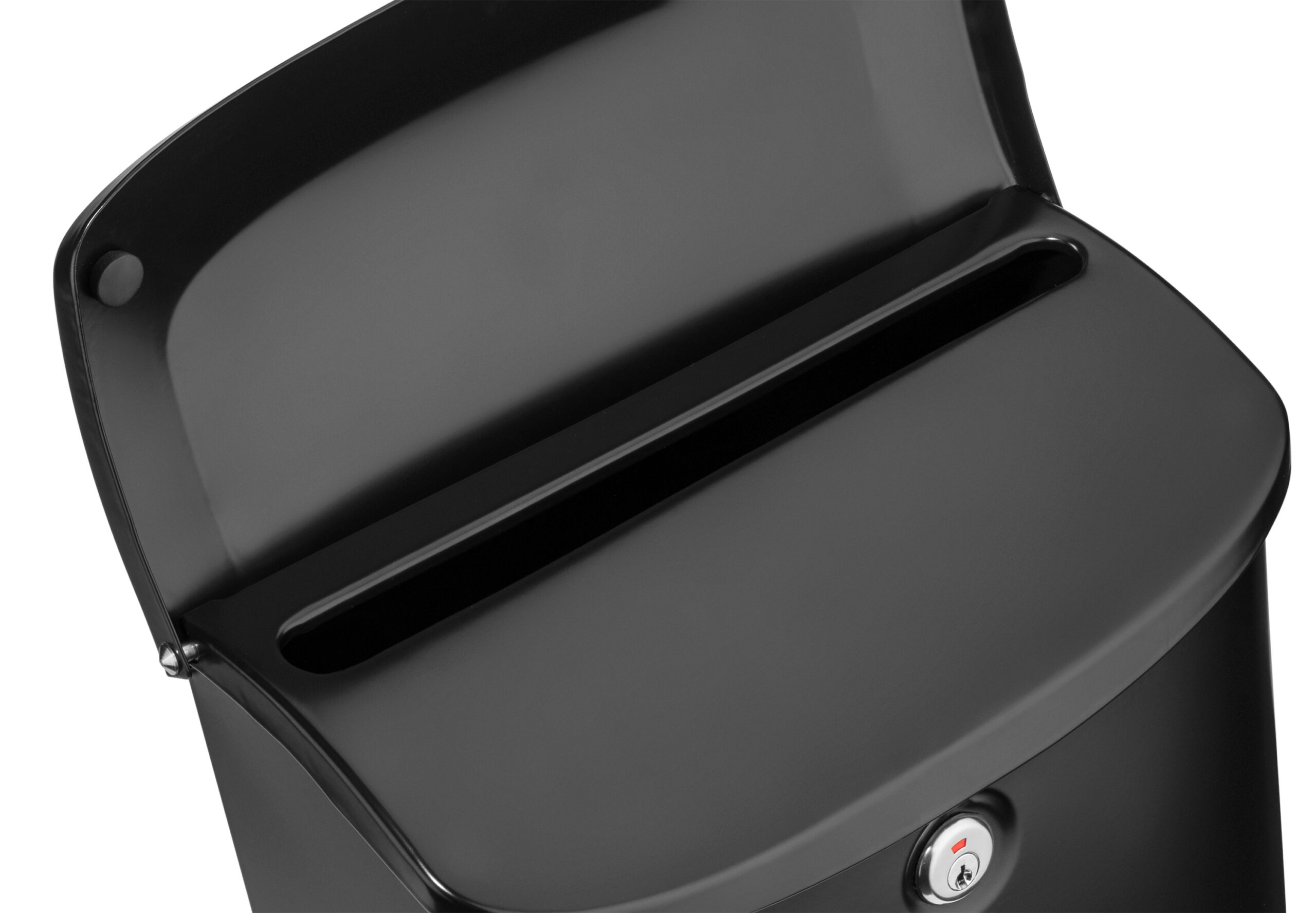 Close-up of a black metal mailbox with a horizontal front slot and a round lock.